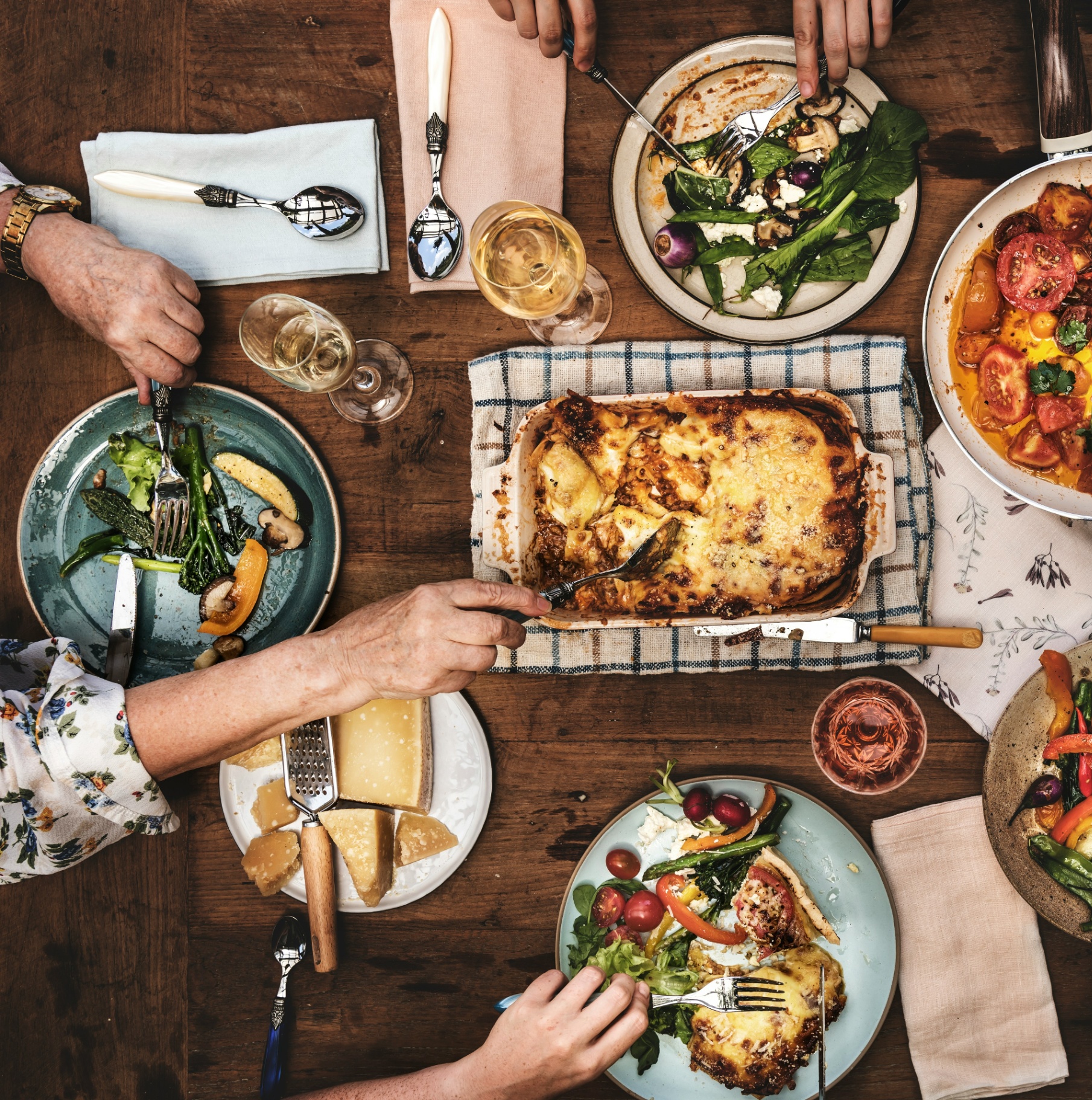 Host family gathered around a table sharing a homemade Italian meal
